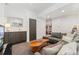 Inviting living area with a gray sectional sofa, stylish coffee table, and convenient wet bar at 3657 Pecos St, Denver, CO 80211