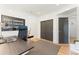 Bright office featuring dark wood desk, black rolling chair, and closet at 3657 Pecos St, Denver, CO 80211