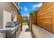 Backyard view with an outdoor grill and nice wood fencing at 3657 Pecos St, Denver, CO 80211