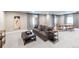 Large basement featuring comfortable seating, a dining area, and stylish decor, perfect for entertaining and relaxation at 565 Pikes View Dr, Erie, CO 80516