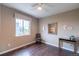 Cozy bedroom with a large window, hardwood floors, neutral walls, and minimalist décor creates a serene space at 565 Pikes View Dr, Erie, CO 80516
