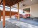 Relaxing covered patio with comfortable seating, stylish outdoor lighting, offering an inviting space for entertaining guests at 565 Pikes View Dr, Erie, CO 80516