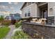 Inviting front porch with comfortable seating and stylish decor, perfect for relaxing outdoors at 565 Pikes View Dr, Erie, CO 80516