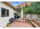 Inviting back deck with a pergola, grill, and bench seating, set against a picturesque rocky hillside at 5085 Red Rock Dr, Larkspur, CO 80118