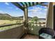 Outdoor balcony boasts scenic views and cozy seating. Perfect for relaxing outdoors at 5085 Red Rock Dr, Larkspur, CO 80118
