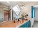 Bathroom vanity featuring a copper sink, tile countertop, and a shower with a window at 5085 Red Rock Dr, Larkspur, CO 80118