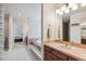Bathroom view with vanity, tiled floor, and step-up tub at 5085 Red Rock Dr, Larkspur, CO 80118
