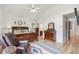 Primary bedroom features a wood sleigh bed, dresser, and a comfortable sitting area at 5085 Red Rock Dr, Larkspur, CO 80118