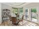 Bright dining area with glass table and access to the backyard, perfect for entertaining at 5085 Red Rock Dr, Larkspur, CO 80118
