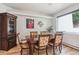 Dining area featuring wood table, decorative cabinet, and a large window showcasing the outside scenery at 5085 Red Rock Dr, Larkspur, CO 80118
