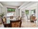 Open dining space with hardwood floors and backyard views, perfect for entertaining and enjoying natural light at 5085 Red Rock Dr, Larkspur, CO 80118