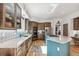 Modern kitchen featuring stainless steel appliances, marble countertops, custom cabinetry, and an open layout perfect for entertaining at 5085 Red Rock Dr, Larkspur, CO 80118