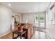 Bright home office featuring a wooden desk, natural light, and views of the outdoors at 5085 Red Rock Dr, Larkspur, CO 80118