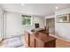 Spacious office with a large wooden desk, providing ample space for work or study at 5085 Red Rock Dr, Larkspur, CO 80118