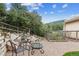 Charming patio with seating and a garden area, offering a cozy outdoor retreat at 5085 Red Rock Dr, Larkspur, CO 80118