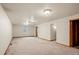 Unfinished basement space with carpeting and natural light at 6196 S Rosewood Dr, Littleton, CO 80121