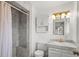 Bathroom featuring a marble tiled shower and updated fixtures at 6196 S Rosewood Dr, Littleton, CO 80121