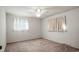 Cozy bedroom with a ceiling fan and windows that offer abundant natural light at 6196 S Rosewood Dr, Littleton, CO 80121
