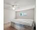 Bedroom with ceiling fan and window at 6196 S Rosewood Dr, Littleton, CO 80121