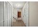 Inviting entryway with closet, stairs, and decorative door at 6196 S Rosewood Dr, Littleton, CO 80121