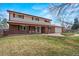 Charming two-story home with an attached garage and long driveway at 6196 S Rosewood Dr, Littleton, CO 80121