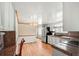 Bright kitchen and breakfast nook with granite countertops, stainless steel appliances, and white cabinets at 6196 S Rosewood Dr, Littleton, CO 80121
