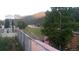 Picture of a backyard with a view of mountains and a highway at 427 Idaho St, Idaho Springs, CO 80452