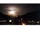 Scenic nighttime view of the full moon and mountains at 427 Idaho St, Idaho Springs, CO 80452
