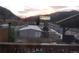 Picture from the backyard patio with view of mountains and nearby buildings at 427 Idaho St, Idaho Springs, CO 80452