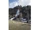 Scenic view of a frozen waterfall, snow, and trees, offering a natural retreat at 427 Idaho St, Idaho Springs, CO 80452
