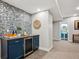 Finished basement bar area with stylish tile backsplash and bar fridge, ideal for entertaining guests at 2321 Alton St, Denver, CO 80238