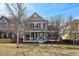 Charming two-story home with a welcoming front porch and landscaped yard at 2321 Alton St, Denver, CO 80238