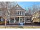 Charming two-story home with a welcoming front porch and landscaped yard at 2321 Alton St, Denver, CO 80238