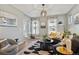 Open-concept living room flowing into the kitchen with hardwood floors and modern decor at 2321 Alton St, Denver, CO 80238