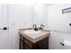 Bathroom featuring a wood vanity, modern fixtures, and neutral tile countertop at 1111 Maxwell Ave # 233, Boulder, CO 80304