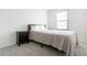 Neutral bedroom featuring plush carpeting, bedside tables, and contemporary accents at 1111 Maxwell Ave # 233, Boulder, CO 80304