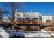 Charming townhome featuring a brick facade, gray siding, wood balconies and a bright, inviting exterior at 1111 Maxwell Ave # 233, Boulder, CO 80304