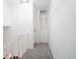 Carpeted hallway and stairway with white walls at 1111 Maxwell Ave # 233, Boulder, CO 80304