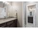 This modern bathroom features a sleek vanity and a luxurious walk-in shower at 1803 Avenida Del Sol, Castle Rock, CO 80104