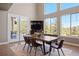 Bright dining room with hardwood floors, French doors, and modern decor at 1803 Avenida Del Sol, Castle Rock, CO 80104