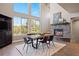 Dining room with high ceilings, view windows, fireplace and modern decor at 1803 Avenida Del Sol, Castle Rock, CO 80104
