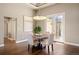Elegant dining area with hardwood floors, stylish chandelier, and modern decor at 1803 Avenida Del Sol, Castle Rock, CO 80104