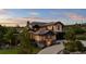 Beautiful two-story home with stone accents, manicured landscaping, and a private balcony at 1803 Avenida Del Sol, Castle Rock, CO 80104