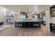 Gourmet kitchen with large center island, stainless steel appliances, and custom cabinetry at 1803 Avenida Del Sol, Castle Rock, CO 80104