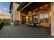 Expansive outdoor patio with black railings, stainless steel grill, and dining area for entertaining at 1803 Avenida Del Sol, Castle Rock, CO 80104