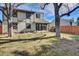 Spacious backyard with mature trees and lawn at 6417 S Florence Way, Englewood, CO 80111