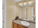 Bathroom features a granite vanity and framed mirror at 6417 S Florence Way, Englewood, CO 80111