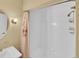 Bright bathroom showcases a shower-tub combo, white tile, and shower curtain at 6417 S Florence Way, Englewood, CO 80111