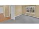 Bedroom with neutral walls, grey carpet and a window providing natural light at 6417 S Florence Way, Englewood, CO 80111