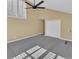 Spacious bonus room includes a ceiling fan and large windows for natural light at 6417 S Florence Way, Englewood, CO 80111